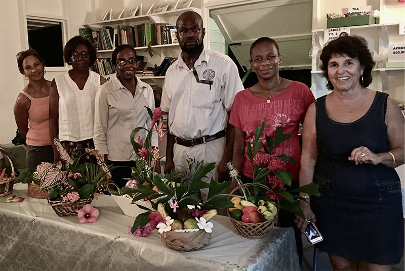ABHS flower arranging class participants display their horticultural creations.